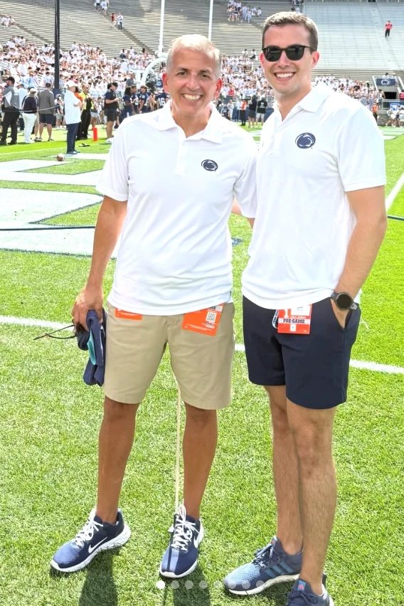 Zach M. and his dad on the field before Marshall
