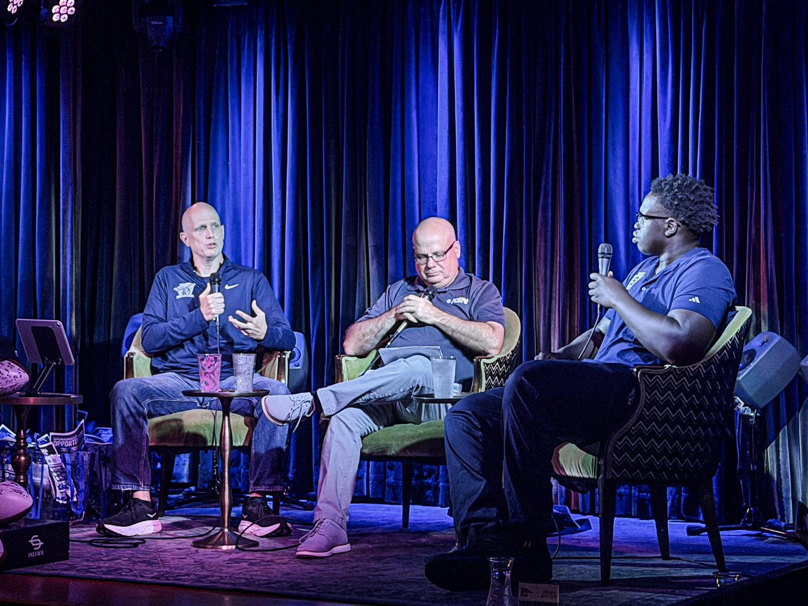 Chris Buchignani, Jim Galanti and a Penn State player on stage at a live Insider Show taping